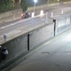 A man on a motorbike stops in the middle of the road